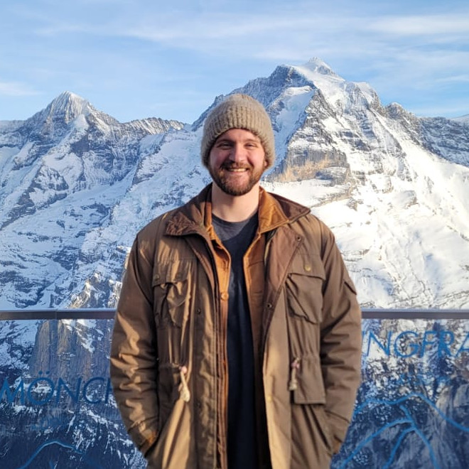 John Moorman standing on a mountaintop